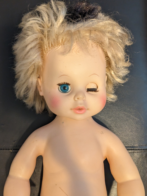 old school SofTina doll who has seen better days