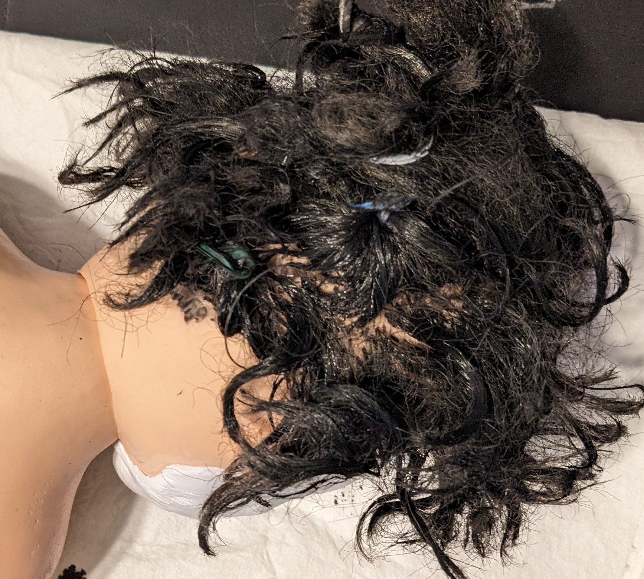 SofTina doll with black paint and glue mixture as hair dye for Vicky Heyes project