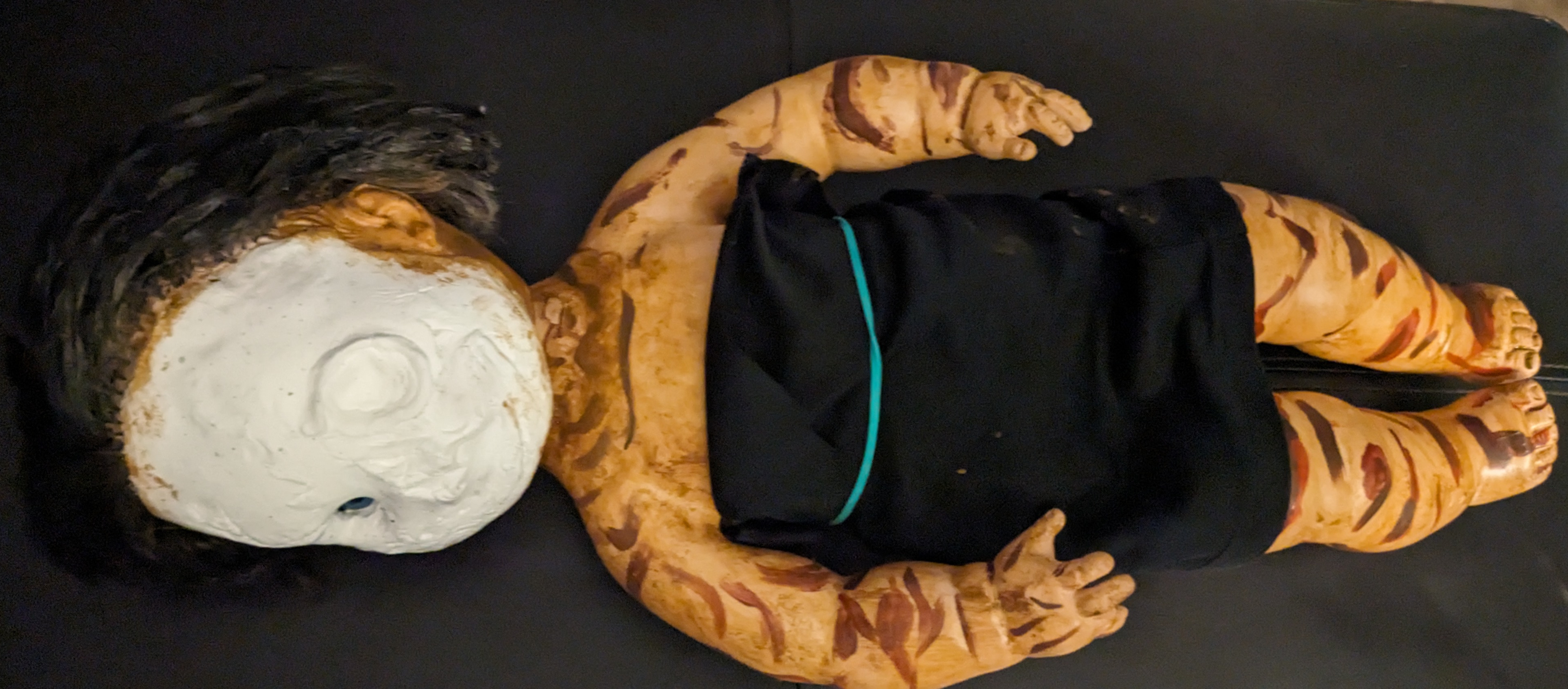 SofTina doll painted to look waterlogged and rotted for Vicky Heyes project